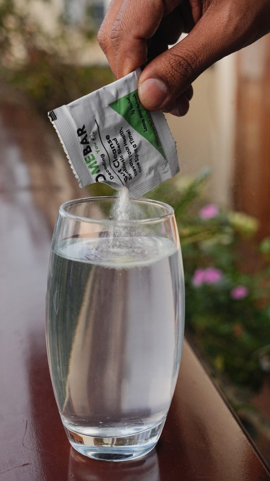 Pouring BioMeBar sachet into water